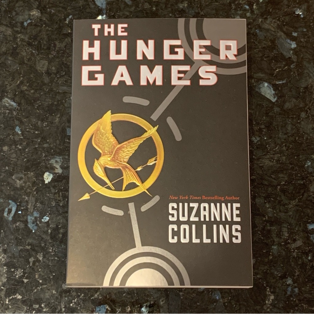 The Hunger Games paperback book by Suzanne Collins